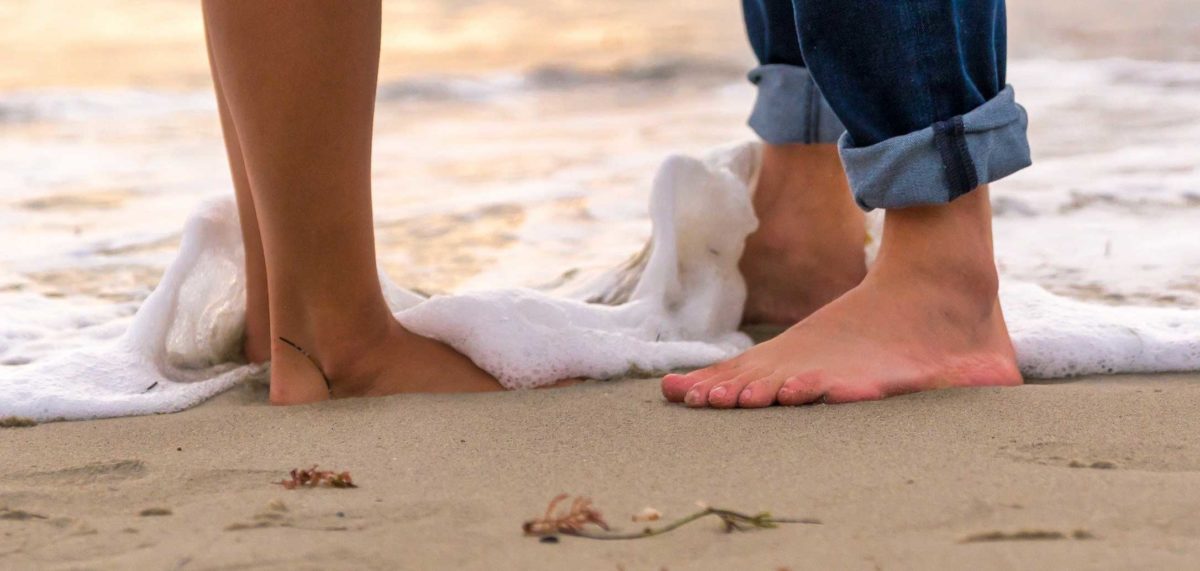 Couple Beach Feet Near Shoreline