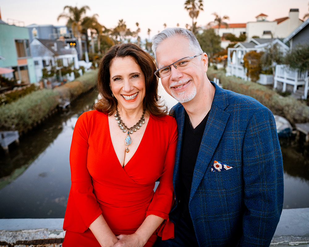 Creating love on purpose founders Orna and Matthew Walters on bridge at Venice Canals.